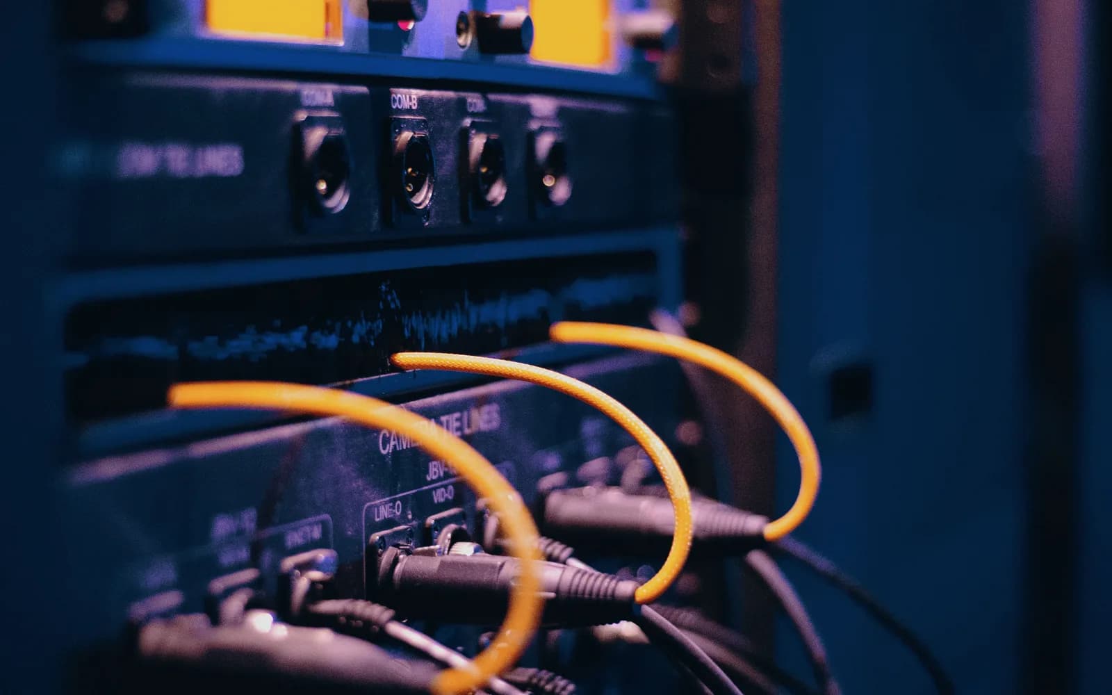 Yellow network cables connected to equipment in a server rack